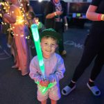 Rick Moyer / Moyer Multi Media LLC
A child holds a neon green lightsaber during the 2023 iteration of Aberdeen Rain Glow Festival. Every year Amy (Moyer) and I have gone to Rain Glow, we have enjoyed the creativity and fun crowd that gathers, said Rick Moyer, who photographed the event. The lights and glow of the event is creative and unique. I love the sense of community and fun that it emits.