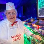 Rick Moyer / Moyer Multi Media LLC
Ruth Hamilton, president of The Friends of the Aberdeen Museum and ardent supporter of the annual Aberdeen Rain Glow Festival, smiles during her cosplay of a penny candy salesperson during the festival in 2023.