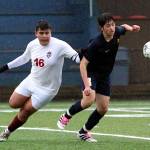 RYAN SPARKS | THE DAILY WORLD Hoquiam defender Jose Fabian (16) and Aberdeen forward/midfielder Marc Avila compete for a loose ball during the Bobcats 5-0 victory on Monday in Aberdeen.