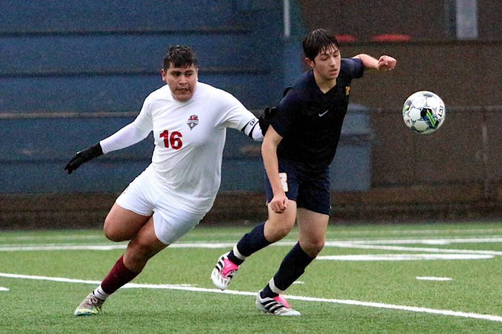 RYAN SPARKS | THE DAILY WORLD Hoquiam defender Jose Fabian (16) and Aberdeen forward/midfielder Marc Avila compete for a loose ball during the Bobcats 5-0 victory on Monday in Aberdeen.