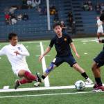 RYAN SPARKS | THE DAILY WORLD Hoquiams JB Fabian (7) attempts to deflect the ball away from Aberdeen defender Javier Lagunas, right, during the Bobcats 5-0 victory on Monday in Aberdeen. Bobcats midfielder Jeremy Bonilla (9) was also involved in the play.