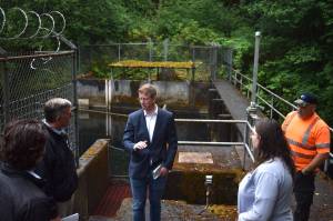 The Daily World file photo
U.S. Rep. Derek Kilmer talks with Hoquiam City Administrator Brian Shay during a July 24, 2024 visit to the West Fork Hoquiam Dam. A recent congressional spending bill includes $500,000 for the citys dam removal and water supply project.