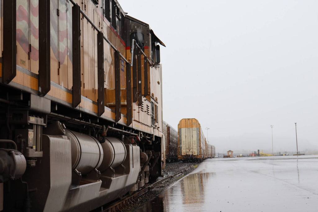 A locomotive sits in anticipation of taking the train of auto transporter cars out of the county once loaded. (Michael S. Lockett / The Daily World)
