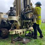Clayton Franke / The Daily World
Emily Bayes, an assistant field geologist with ConeTec, the company hired to conduct soil stability assessments at the Hoquiam School District, operates a drilling machine at the Hoquiam High School baseball field on Feb. 21.