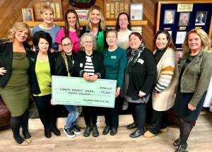 Matthew N. Wells / The Daily World
Many of the 100+ Harbor Women Who Care core members stand behind and alongside the winning organization from Tuesdays event, Domestic Violence Center of Grays Harbor, which is poetic, because thats what 100+ Harbor Women Who Care does. The group supports nonprofits around the Harbor who need help. As of Thursday afternoon, they have helped raise $108,135. They helped raise almost one-third of that on Tuesday at Hoquiam Elks Lodge 1082, which graciously supports the group with a large space for their now twice yearly events. The next event is scheduled for Oct. 8, at Hoquiam Elks Lodge.