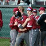 RYAN SPARKS | THE DAILY WORLD Hoquiams Tristin Bland, right, congratulates Chase Shumate after Shumate scored a run during a 16-3 loss to Aberdeen on Thursday in Hoquiam.