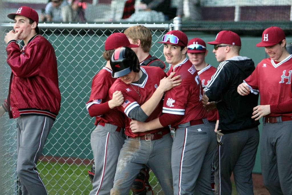RYAN SPARKS | THE DAILY WORLD Hoquiams Tristin Bland, right, congratulates Chase Shumate after Shumate scored a run during a 16-3 loss to Aberdeen on Thursday in Hoquiam.