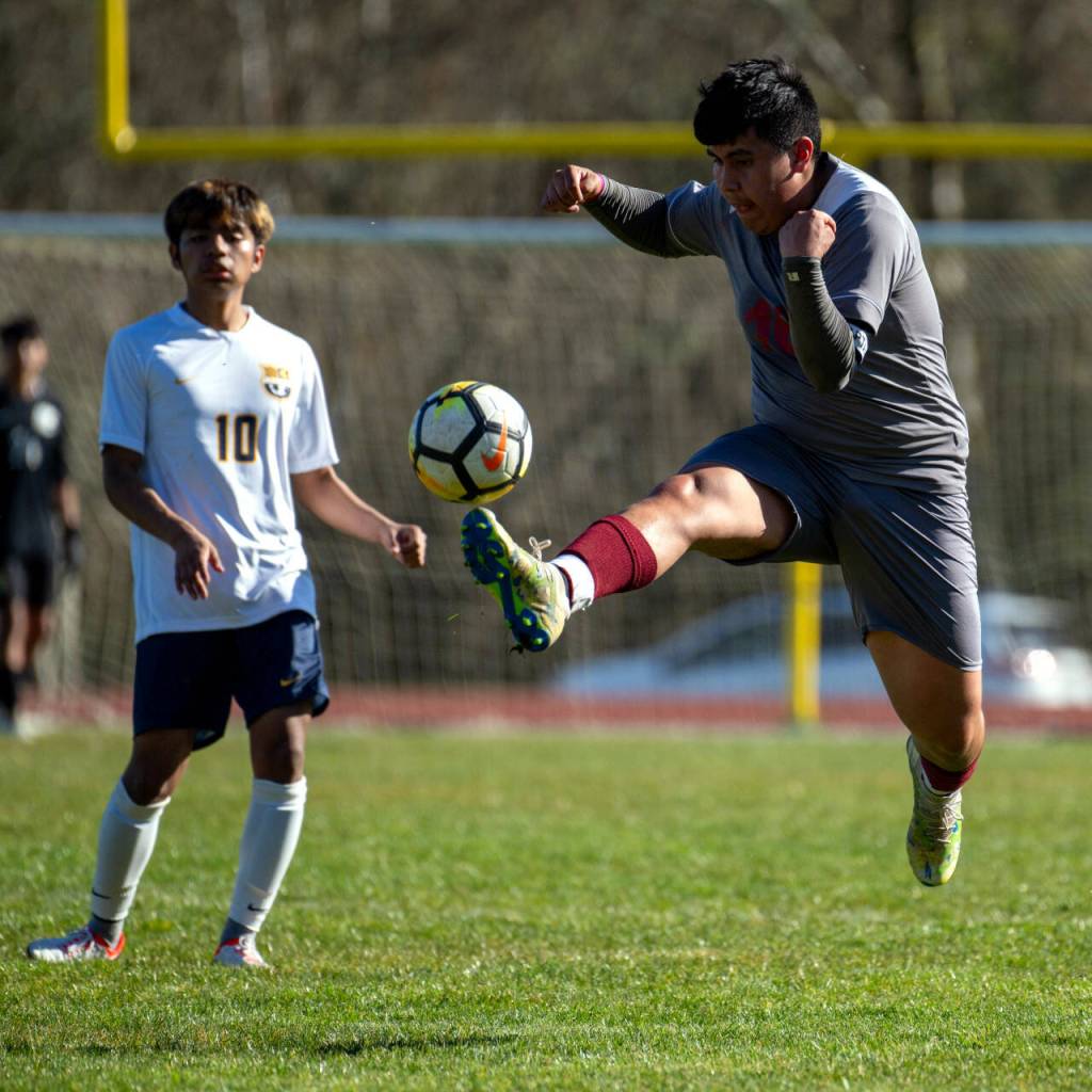 PHOTO BY FOREST WORGUM Hoquiams Jose Fabian leaps to make a play during the Grizzlies 2-1 overtime victory over Forks on Saturday in Hoquiam.