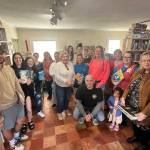 Matthew N. Wells / The Daily World
Aberdeen Cash Mob helped make Saturday the most successful sales day for Harbor Books  2200 Simpson Ave., in Hoquiam  and its owners, Melinda Einander and her wife Kaide. The group was also able to help another small business, Solid Coffee  1941 Riverside Ave., in Hoquiam. Cash Mob is such a good (way) to see all the small places, either the ones you knew about or the ones you never knew were there, said Stephanie Navarra, who was shopping with an exuberant and wandering toddler. This is so cool. I hope more people come because this was a great turnout.