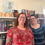 Matthew N. Wells / The Daily World
Melinda Einander, owner of Harbor Books, stands in front of a host of books and the all important word, READ, that is proudly displayed in her store. Her wife, Kaide, stands next to her and supports Melinda in whatever way she can. The independent bookstore not only sells new and used books, but it also takes donations, offers audio books and more.