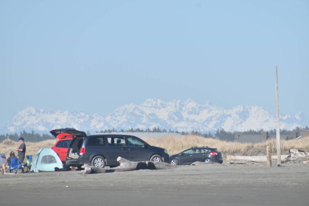 Beaches near Ocean Shores were busy on Saturday, March 16 as the warmest weather of 2024 to date provided comfortable clamming weather and clear views of the Olympic mountains. (Clayton Franke / The Daily world)