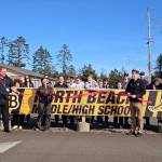 Dr. Laura Galati cuts a ceremonial ribbon March 14, celebrating the opening of a School-Based Health Center inside North Beach Junior/Senior High School. (Courtesy of Leigh Rowley / Grays Harbor County Public Health)