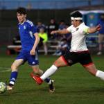 RYAN SPARKS / THE DAILY WORLD 
Elmas Hank Doelman, left, passes the ball during a 9-0 win over Tenino on Monday in Montesano.