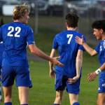 RYAN SPARKS / THE DAILY WORLD Elma co-captains Cason Seaberg (22) and Jose Torres, right, celebrate a goal in a 9-0 win over Tenino on Monday in Montesano.