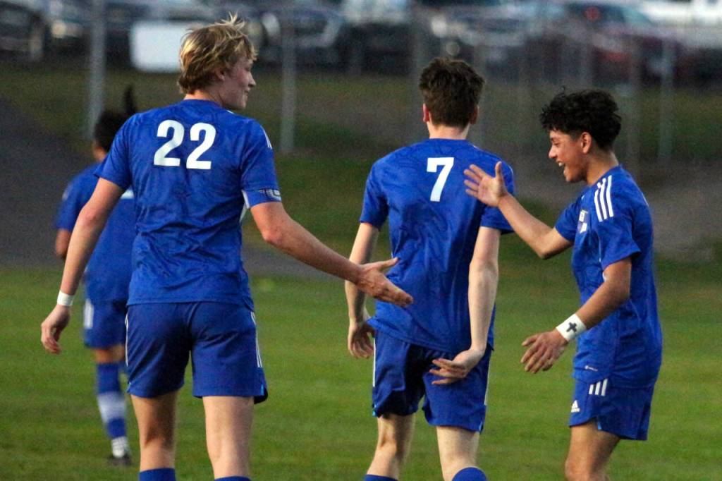 RYAN SPARKS / THE DAILY WORLD Elma co-captains Cason Seaberg (22) and Jose Torres, right, celebrate a goal in a 9-0 win over Tenino on Monday in Montesano.