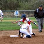 RYAN SPARKS | THE DAILY WORLD Black Hills Madison Mounts slides in around the tag of Aberdeen shortstop Zoe Vessey (1) during the Bobcats 10-0 five-inning victory on Wednesday at the Bishop Sports Complex in Aberdeen.