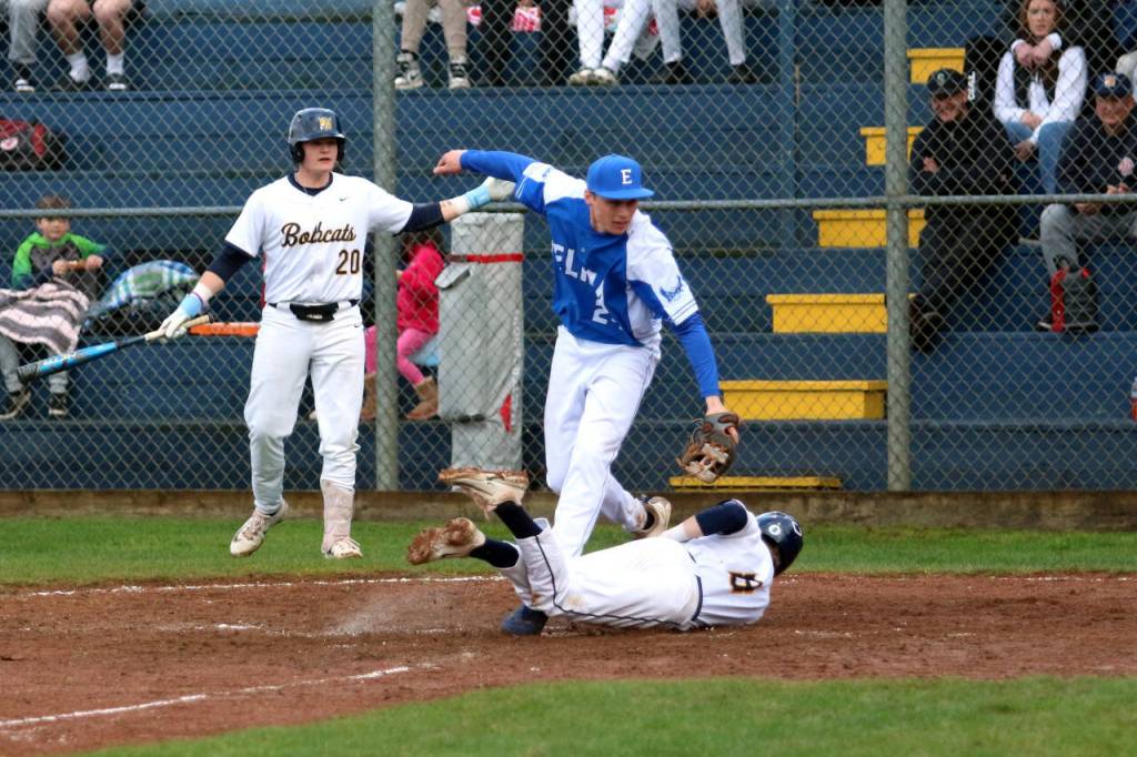 RYAN SPARKS | THE DAILY WORLD Aberdeens Sam Schreiber (8) beats the tag of Elma relief pitcher Carter Studer during the Eagles 5-3 win on Friday at Pioneer Park in Elma.