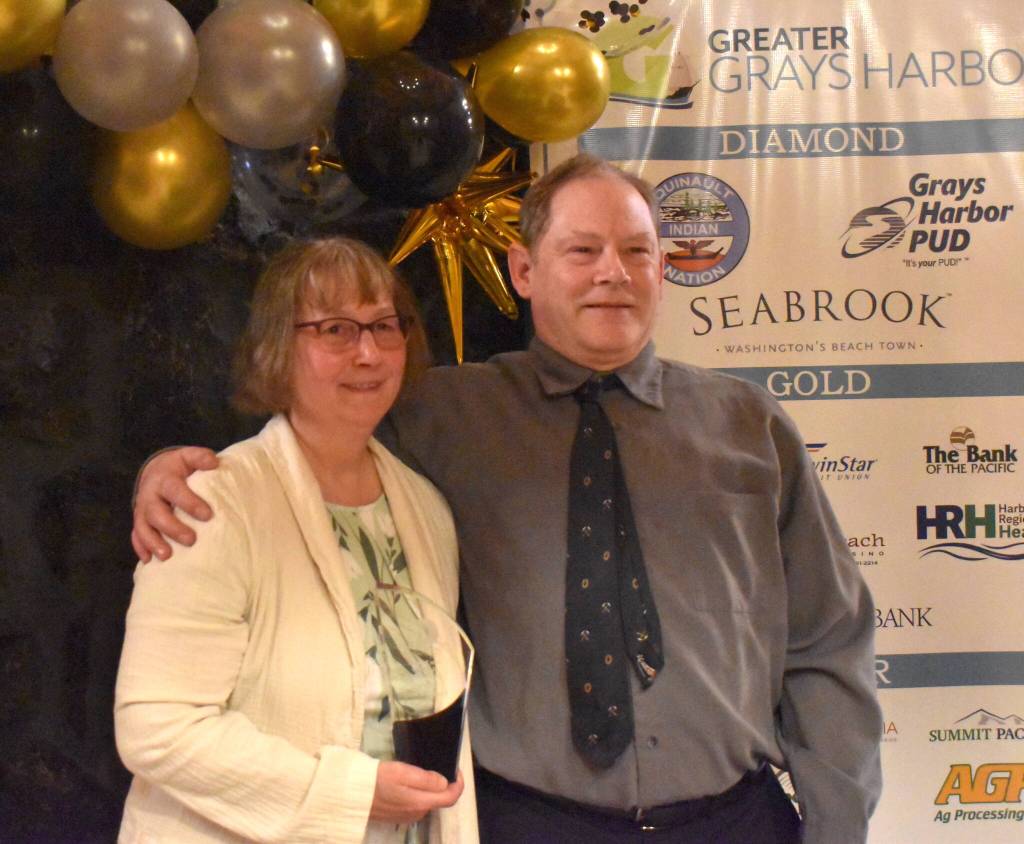 Matthew N. Wells / The Daily World
Raeann Edwards and her husband Duncan, owners of Snowbird Farm & Cidery, accepted the award for New Business of the Year on Friday night at the Rotary Log Pavilion. Raeann, who commented on the award, gave a humble response. Heres part of what she said. It really was a surprise and honor to be awarded new business of the year, she said. We have been overwhelmed by the support and love that the community has given us. Snowbird Farm & Cidery beat out Lorraines Candle Studio, Two Broke Chics, and UNPLUGGED: Kurt Cobain Tribute Gallery.