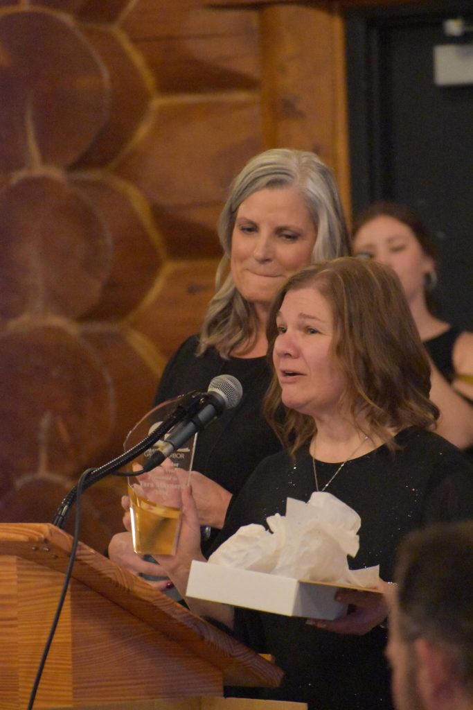 Tara Maynard, center, accepts Greater Grays Harbor, Inc.s Ambassador of the Year award from Stephanie Conway, who, standing to the left, is GGHIs director of member services. Maynard took point with the ambassador group, according to Conway, who had rotator cuff surgery months ago. And I absolutely appreciate all the hard work and many hours that she spent taking care of all of you with ribbon cuttings and celebrations and milestone events, and just kept the momentum going seamlessly. I absolutely cannot tell you how wonderful she has been, Conway said. (Matthew N. Wells / The Daily World)