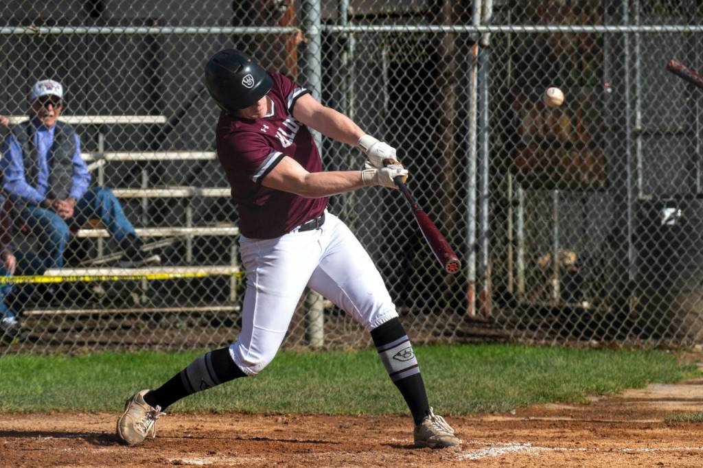 PHOTO BY FOREST WORGUM Montesanos Cam Taylor drives in a pair of runs with a base hit during a 10-6 loss to Tenino on Tuesday in Montesano.