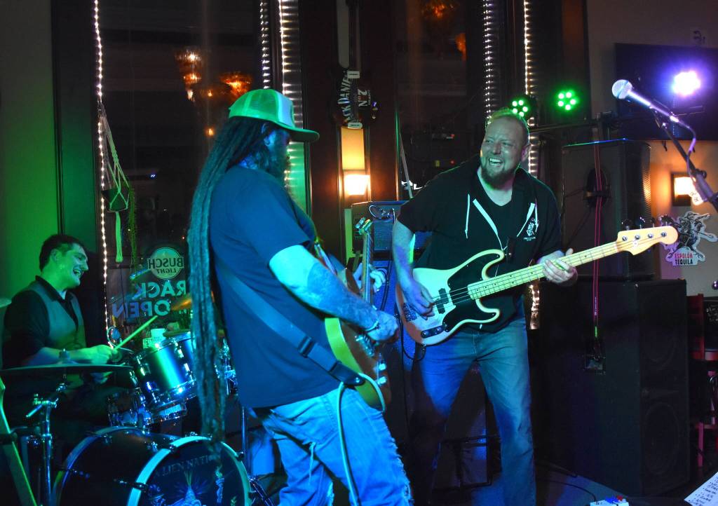 Matthew N. Wells / The Daily World
A Lien Nation, from left, drummer Johnathon Cave, guitarist and singer Chris Haley, and Casey Kunning, received praise for how tight they sounded during their set, the final of Saturday nights bill at Messy Jessys Bar and Grill. They were in perfect sync and having a blast playing, which makes it more enjoyable of an experience for everyone, said Dustin Knutson, who co-owns the venue with his wife, Messy Jessy.