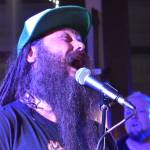 Matthew N. Wells / The Daily World
Chris Haley, guitarist and singer for A Lien Nation, screams into the microphone during the bands set Saturday night at Messy Jessys. Casey Kunning, the bands bassist, right, and Johnathon Cave, not pictured, were in sync with Haley as the band impressed the crowd so much they asked for an encore. Haley said A Lien Nation never had a crowd yell for an encore in a club before. He called the moment the cherry on top.