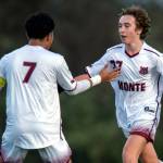 PHOTO BY FOREST WORGUM Montesanos Jules Desour, right, is congratulated by Cris Tobar after scoring a goal in the first half of a 3-1 win over Elma on Wednesday at Elma High School.