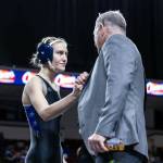 SUBMITTED PHOTO Grays Harbor College wrestler Alexandria Kauffman-Templeton, left, talks with head coach Kevin Pine during the NCWA National Championships in March in Louisiana. Pine resigned on Monday.