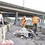 Clayton Franke / The Daily World
City of Aberdeen workers sweep the last of the debris from a River Street homeless camp cleanup April 3. The city will perform intensive cleanups there once per month moving forward.