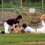 PHOTO BY FOREST WORGUM Montesano third basemen Toren Crites, left, tags out a Colville runner during a 20-6 win on Friday at Ranger Baseball Field in Naches.