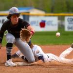 PHOTO BY FOREST WORGUM Montesano third baseman Toren Crites, left, receives a throw during a 5-1 win over Naches Valley on Saturday in Naches.