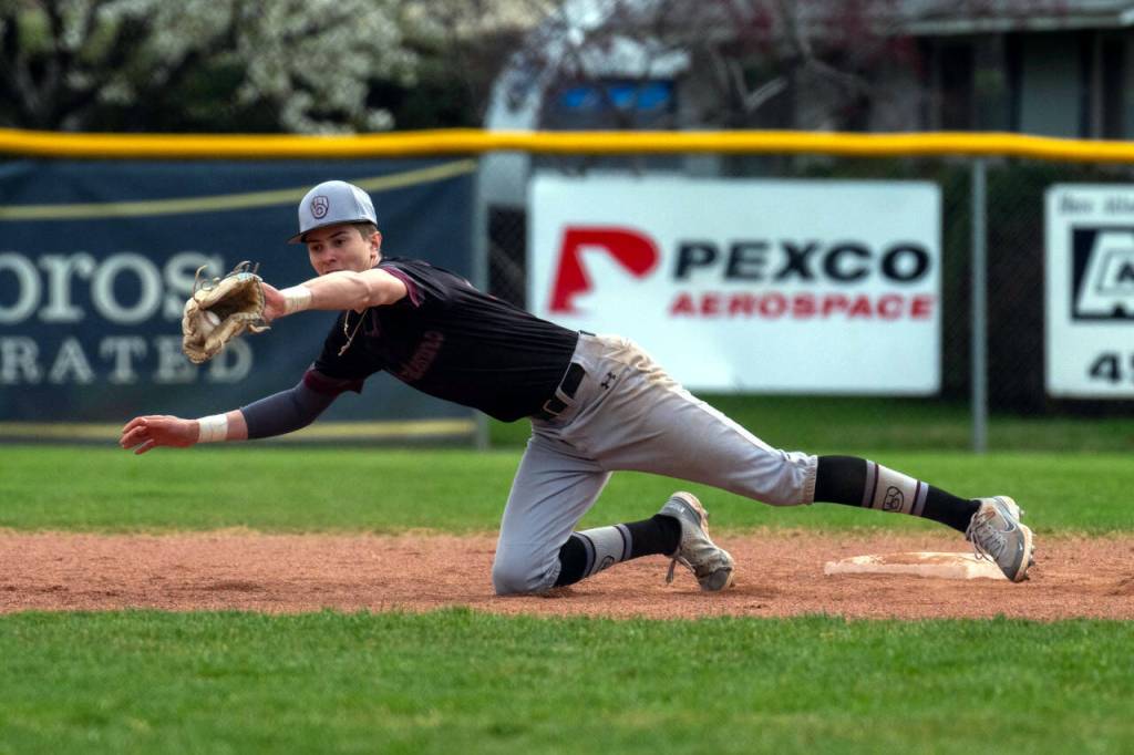 PHOTO BY FOREST WORGUM Montesano shortstop Bode Poler makes a diving stop during a 5-1 win over Naches Valley on Saturday at the Ranger Baseball Field in Naches.
