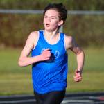 RYAN SPARKS | THE DAILY WORLD Elma freshman Frank Roberts swept both the 1600 (pictured) and 3200 races at the Ray Ryan Memorial All-County Meet on Friday in Ocean Shores.