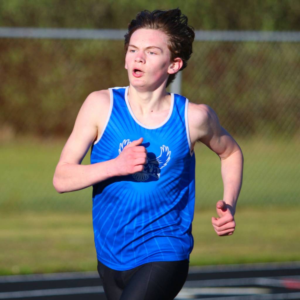 RYAN SPARKS | THE DAILY WORLD Elma freshman Frank Roberts swept both the 1600 (pictured) and 3200 races at the Ray Ryan Memorial All-County Meet on Friday in Ocean Shores.