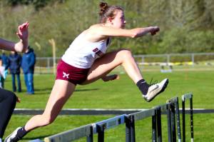 RYAN SPARKS | THE DAILY WORLD Montesanos Sam Roundtree leads the field en route to a win in the 100-meter hurdles at the Ray Ryan Memorial All-County Meet on Friday in Ocean Shores.