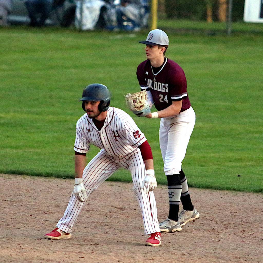 RYAN SPARKS | THE DAILY WORLD Montesano shortstop Bode Poler (24) shadows Hoquiams Dom Standstipher during the Bulldogs 6-0 win on Monday in Montesano.