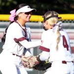 RYAN SPARKS | THE DAILY WORLD Montesano centerfielder Adda Potts, left, is congratulated by shortstop Addi Kersker after making a diving catch during a 7-1 loss to Auburn Riverside on Tuesday at Montesano High School.