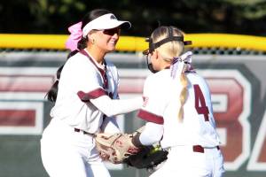 RYAN SPARKS | THE DAILY WORLD Montesano centerfielder Adda Potts, left, is congratulated by shortstop Addi Kersker after making a diving catch during a 7-1 loss to Auburn Riverside on Tuesday at Montesano High School.