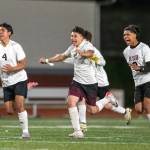 PHOTO BY FOREST WORGUM Raymond-South Bends Christopher Quintana (4), Michael Nunez (middle) and Adam Mora celebrate a 3-2 win (4-2 on penalty kicks) over Montesano on Friday at Montesano High School