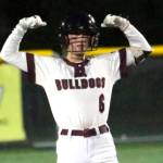 RYAN SPARKS | THE DAILY WORLD 
Montesano right fielder Carsyn Wintrip flexes toward her teammates after hitting an RBI double during a 7-3 win over Rochester on Saturday in Montesano.