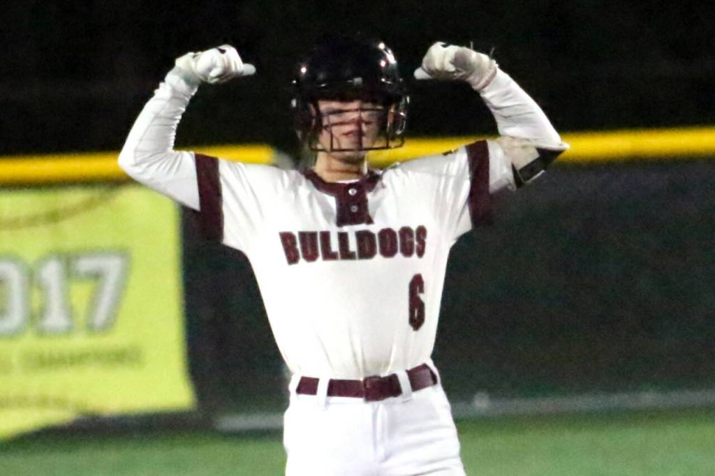 RYAN SPARKS | THE DAILY WORLD 
Montesano right fielder Carsyn Wintrip flexes toward her teammates after hitting an RBI double during a 7-3 win over Rochester on Saturday in Montesano.