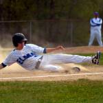PHOTO BY FOREST WORGUM Elmas TJ Dunlap slides into third base during a double header against Eatonville on Saturday in Elma.