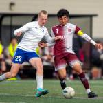 PHOTO BY FOREST WORGUM 
Elmas Cason Seaberg (22) and Montesanos Cris Tobar jostle for possession during the Bulldogs 1-0 win on Monday at Jack Rottle Field in Montesano.