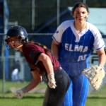 RYAN SPARKS | THE DAILY WORLD Montesanos Carsyn Wintrip, left, leads off first while Elma first baseman Callie Galligan looks toward home plate during the Bulldogs 8-7 win on Monday in Elma.