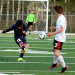 RYAN SPARKS | THE DAILY WORLD Aberdeen senior defender Chris Garcia (12) sends the ball forward during the Bobcats 3-2 loss (4-3 on penalty kicks) to Centralia on Monday in Aberdeen.