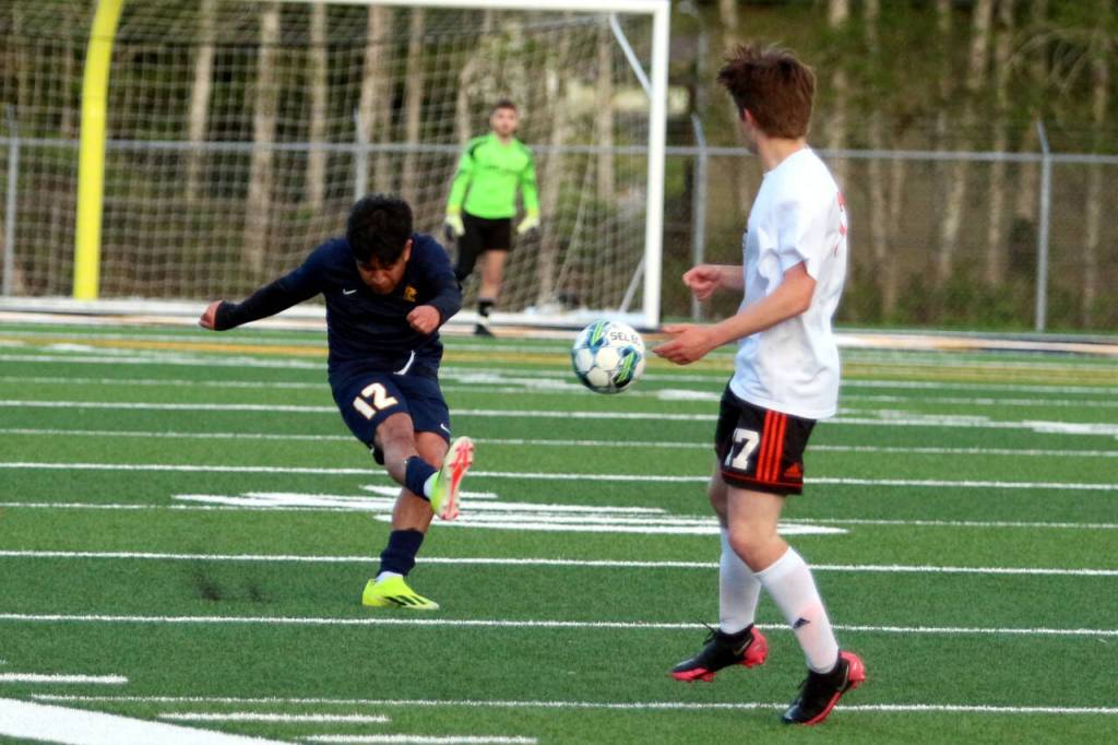 RYAN SPARKS | THE DAILY WORLD Aberdeen senior defender Chris Garcia (12) sends the ball forward during the Bobcats 3-2 loss (4-3 on penalty kicks) to Centralia on Monday in Aberdeen.