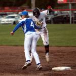 ZACH MARTIN | THE CHRONICLE Elma first baseman Grant Vessey tags out Teninos Carson Hart in the Eagles 3-2 loss on Tuesday in Tenino.