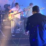 Amy Moyer of Moyer Multi Media LLC.
Rick Moyer, right, films Brian Smith, on bass, and the rest of Hall Aflame inside the old Goldbergs recliner show room inside the Side One Studios in order to make the video for the track 1974, which will appear on the bands new album Amplifire.