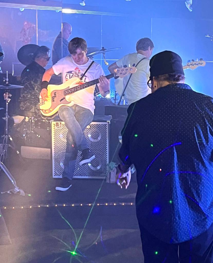 Amy Moyer of Moyer Multi Media LLC.
Rick Moyer, right, films Brian Smith, on bass, and the rest of Hall Aflame inside the old Goldbergs recliner show room inside the Side One Studios in order to make the video for the track 1974, which will appear on the bands new album Amplifire.