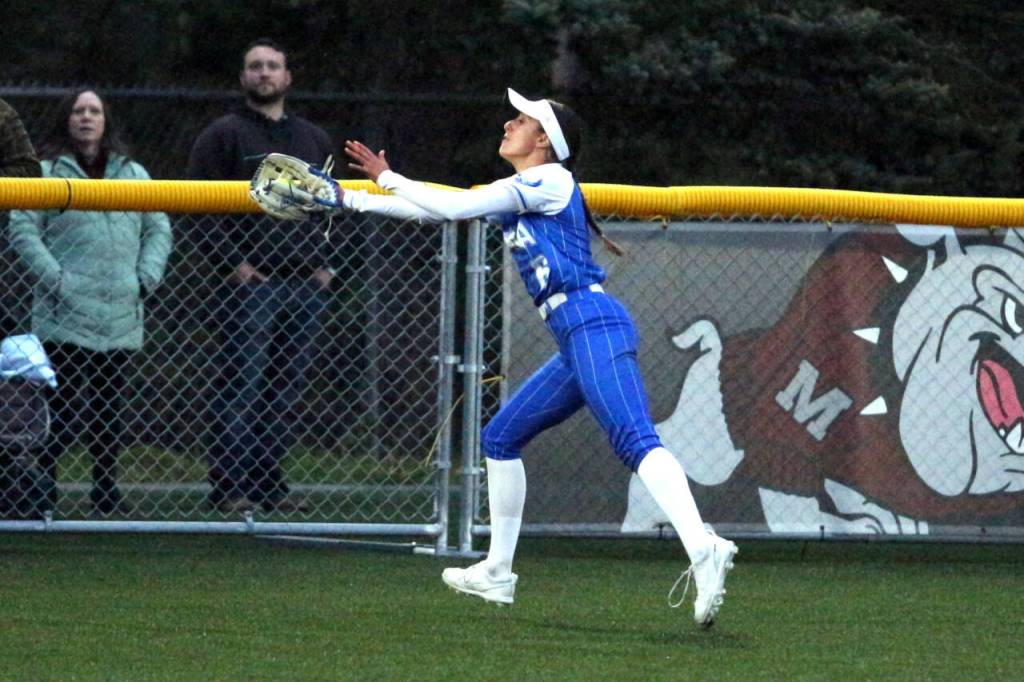 RYAN SPARKS | THE DAILY WORLD Elma center fielder Mia Monroe makes an over-the-shoulder catch during a 7-0 loss to Montesano on Wednesday in Montesano.